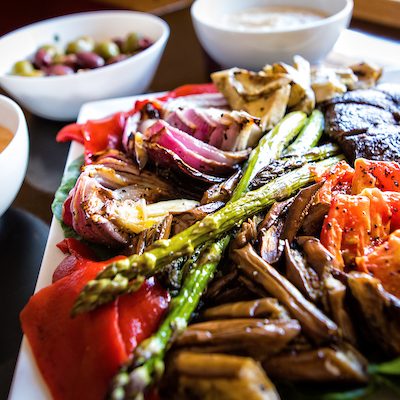 Vegetarian and vegan options for buffet on a silver tray